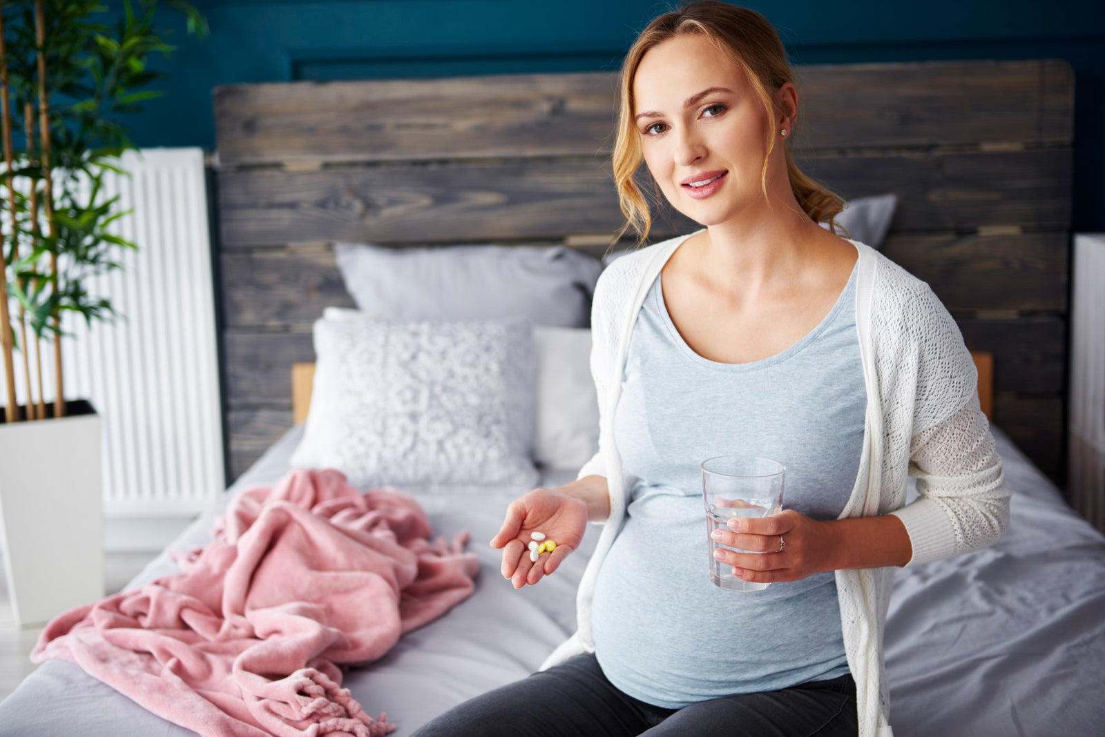 pregnant woman taking prenatal vitamins