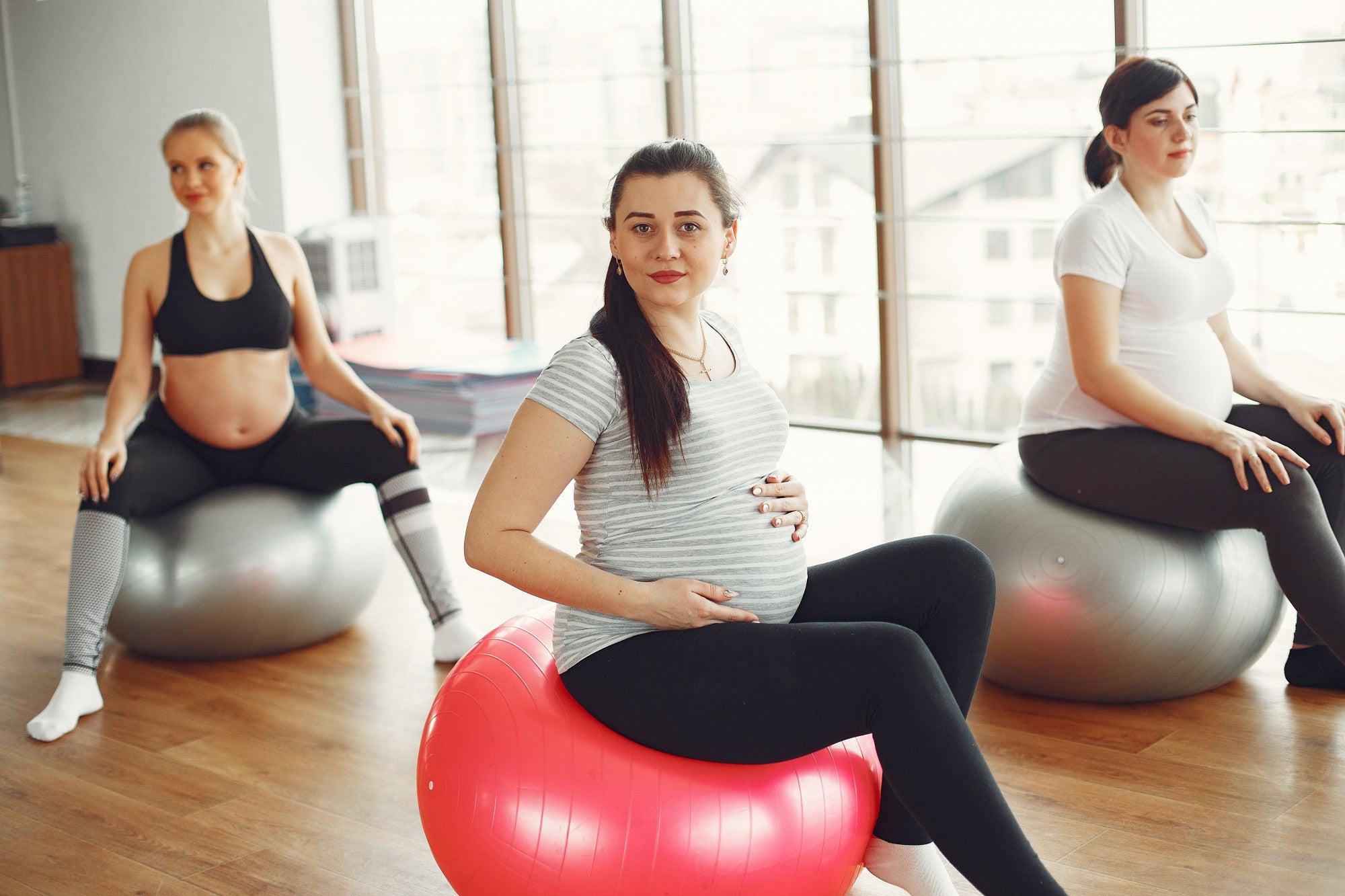 Pregnant women doing yoga